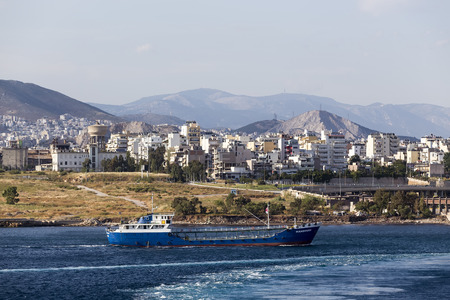 Pireas, Greece- May 12, 2015: Ferry boats, cruise ships docking at the port of Piraeus, Greece. The...