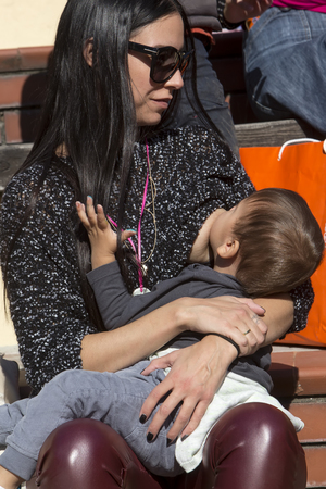 Thessaloniki, Greece, November 1 2015: Mother breastfeeding her baby on the 6th Nationwide public breastfeeding in celebration of World Breastfeeding Weekのeditorial素材