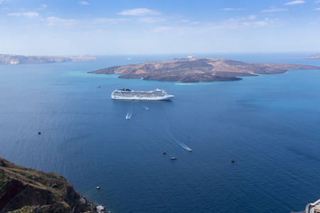 Santorini, Grece- May 13, 2015: Luxury cruise ship sailing around Santorini island, Aegean sea in Greece.のeditorial素材
