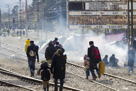 Idomeni, Greece,  November 29, 2015: Hundreds of immigrants are in a wait at the border between Greece and FYROM waiting for the right time to continue their journey from unguarded passagesのeditorial素材