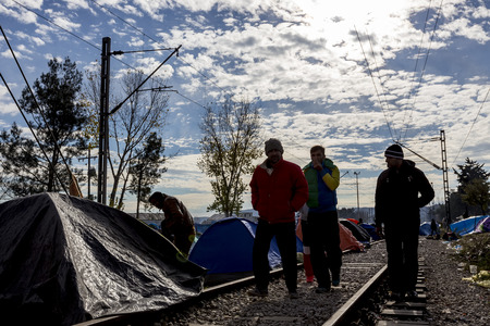 Idomeni, Greece,  November 29, 2015: Hundreds of immigrants are in a wait at the border between Greece and FYROM waiting for the right time to continue their journey from unguarded passagesのeditorial素材