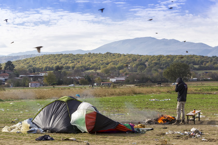 Idomeni, Greece,  November 29, 2015: Hundreds of immigrants are in a wait at the border between Greece and FYROM waiting for the right time to continue their journey from unguarded passagesのeditorial素材