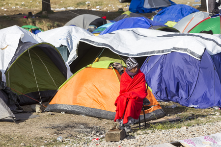 Idomeni, Greece,  November 29, 2015: Hundreds of immigrants are in a wait at the border between Greece and FYROM waiting for the right time to continue their journey from unguarded passagesのeditorial素材