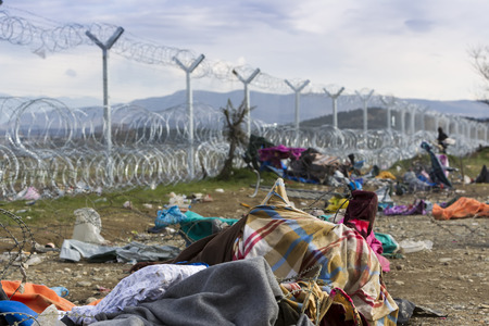 Idomeni, Greece,  November 29, 2015: Hundreds of immigrants are in a wait at the border between Greece and FYROM waiting for the right time to continue their journey from unguarded passagesのeditorial素材