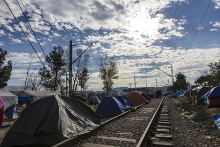 Idomeni, Greece,  November 29, 2015: Hundreds of immigrants are in a wait at the border between Greece and FYROM waiting for the right time to continue their journey from unguarded passagesのeditorial素材