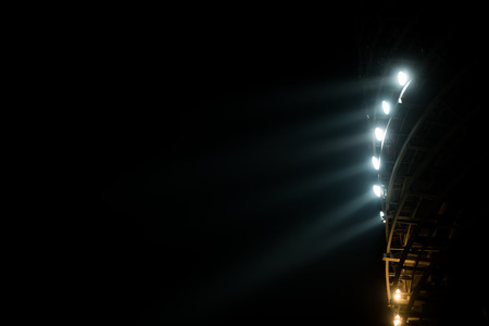 Bright white and yellow Stadium lights with fogの写真素材