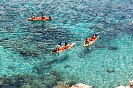 Milos, Greece - September 10, 2015: Tourists kayaking at Tsigrado Beach in Milos island, Cyclades, Greeceのeditorial素材