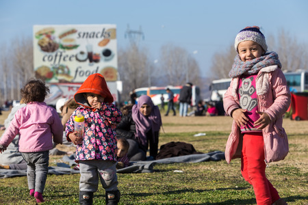 Polykastro, Greece, February 7, 2016: Thousands migrants and refugees are waiting in the parking lot of a gas station in order to cross the borders to FYR of Macedoniaのeditorial素材