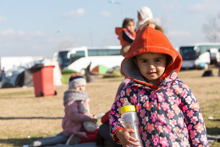 Polykastro, Greece, February 7, 2016: Thousands migrants and refugees are waiting in the parking lot of a gas station in order to cross the borders to FYR of Macedoniaのeditorial素材