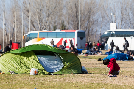 Polykastro, Greece, February 7, 2016: Thousands migrants and refugees are waiting in the parking lot of a gas station in order to cross the borders to FYR of Macedoniaのeditorial素材