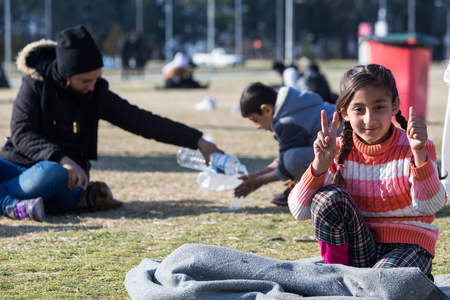 Polykastro, Greece, February 7, 2016: Thousands migrants and refugees are waiting in the parking lot of a gas station in order to cross the borders to FYR of Macedoniaのeditorial素材