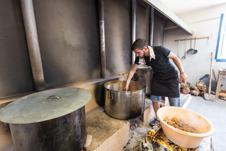Ios, Greece - September 7, 2015: Traditional Greek food is being prepared for the big yearly festival in the name of Holy Mary in Ios, Greece.のeditorial素材