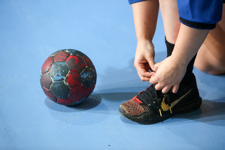 Thessaloniki, Greece - February 13, 2016: Undefined hands holding a ball prior to the Greek Women Cup Final handball game Arta vs Nea Ioniaのeditorial素材