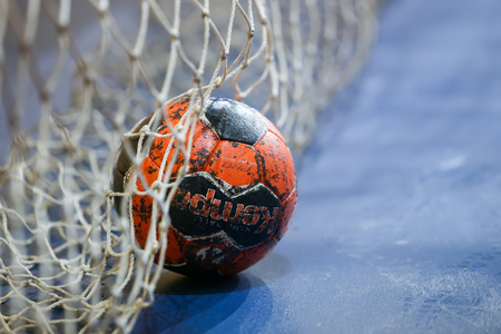 Thessaloniki, Greece - February 13, 2016: Handball ball on the goalpost net prior to the Greek Women Cup Final handball game Arta vs Nea Ioniaのeditorial素材
