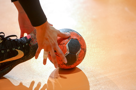 Thessaloniki, Greece - February 13, 2016: Undefined hands holding a ball prior to the Greek Women Cup Final handball game Arta vs Nea Ioniaのeditorial素材
