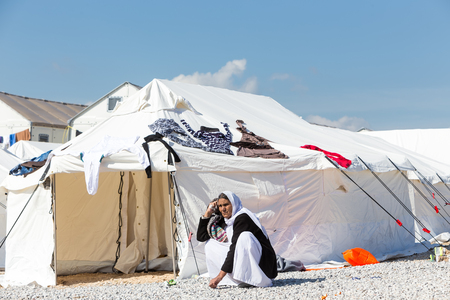 Thessaloniki, Greece - February 25, 2016: Refugees  living in tents in the center relocation Diavata waiting to continue  their journey the border between Greece and FYROM and from there to europeのeditorial素材