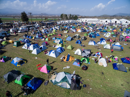 Idomeni, Greece - March 1, 2016: Thousands of immigrants are in a wait at the border between Greece and FYROM waiting to cross the borders to FYR of Macedonia. Aerial shot with droneのeditorial素材