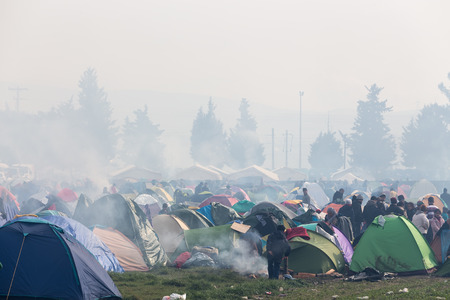 Idomeni, Greece - March 8, 2016: Thousands of immigrants are in a wait at the border between Greece and FYROM waiting to cross the borders to FYR of Macedonia.のeditorial素材