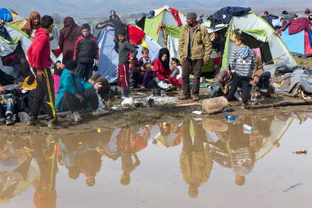 Idomeni, Greece - March 8, 2016: Thousands of immigrants are in a wait at the border between Greece and FYROM waiting to cross the borders to FYR of Macedonia.のeditorial素材