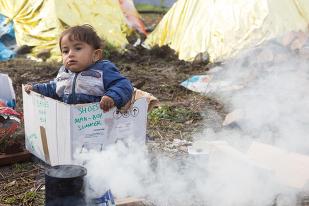 Idomeni, Greece - March 8, 2016: Thousands of immigrants are in a wait at the border between Greece and FYROM waiting to cross the borders to FYR of Macedonia.のeditorial素材