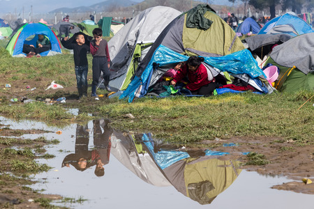 Idomeni, Greece - March 8, 2016: Thousands of immigrants are in a wait at the border between Greece and FYROM waiting to cross the borders to FYR of Macedonia.のeditorial素材