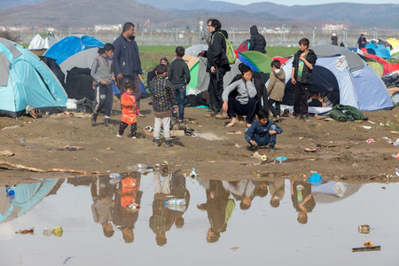 Idomeni, Greece - March 8, 2016: Thousands of immigrants are in a wait at the border between Greece and FYROM waiting to cross the borders to FYR of Macedonia.のeditorial素材