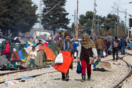 Idomeni, Greece - March 8, 2016: Thousands of immigrants are in a wait at the border between Greece and FYROM waiting to cross the borders to FYR of Macedonia.のeditorial素材