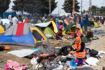 Idomeni, Greece - March 8, 2016: Thousands of immigrants are in a wait at the border between Greece and FYROM waiting to cross the borders to FYR of Macedonia.のeditorial素材