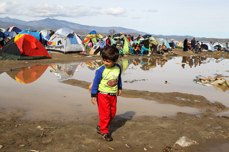 Idomeni, Greece - March 8, 2016: Thousands of immigrants are in a wait at the border between Greece and FYROM waiting to cross the borders to FYR of Macedonia.のeditorial素材