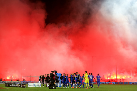 Thessaloniki, Greece - March 02, 2016: View of the Toumba Stadium full of fans of PAOK who light flares during the semifinal Greek Cup game between PAOK and Olympiacos played at Toumba stadiumのeditorial素材