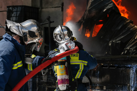 Aspopirgos, Greece - March 28, 2016: Firefighters struggle to extinguish the fire that broke out at...