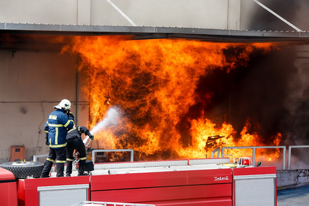 Aspopirgos, Greece - March 28, 2016: Firefighters struggle to extinguish the fire that broke out at a paint factoryのeditorial素材