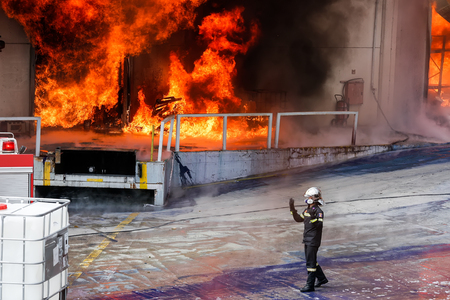 Aspopirgos, Greece - March 28, 2016: Firefighters struggle to extinguish the fire that broke out at a paint factoryのeditorial素材