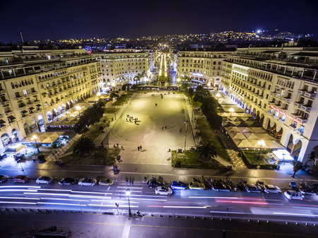 Thessaloniki, Greece - January 29, 2016: Aerial view of Aristotelous Square and the northern Greek city Thessaloniki at night. Image taken with action drone camera causing distortion and blur.のeditorial素材