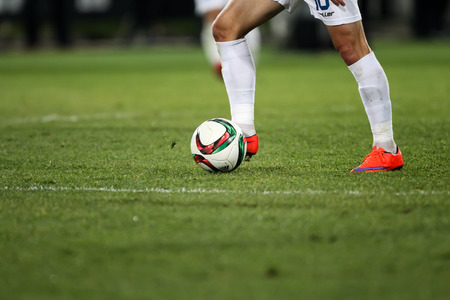 Thessaloniki, Greece - January 30, 2016: Closeup of soccer ball and feet of the player during a match for the Greek leagueのeditorial素材