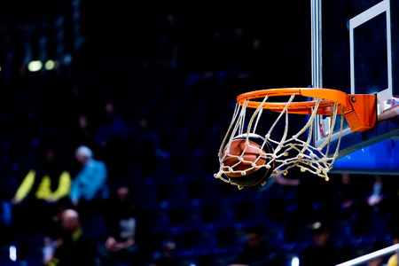 Thessaloniki, Greece - December 19, 2015: Basketball ball going through the net during the Greek Basket League game Aris vs Panathinaikosのeditorial素材