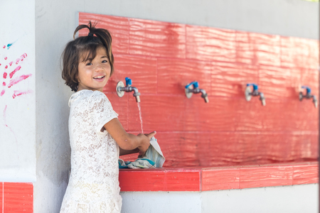 Lagadikia, Greece - August 25, 2016: Children play in the refugee camp of Lagadikia, some 40km North of Thessaloniki, during the visit of UN high commissioner for refugees Filippo Grandiのeditorial素材