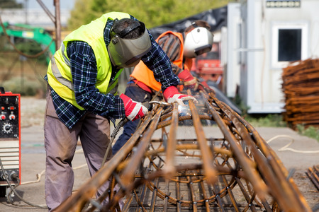 Thessaloniki, Greece - September 15, 2016: Unidentified workers working with concrete iron at a...