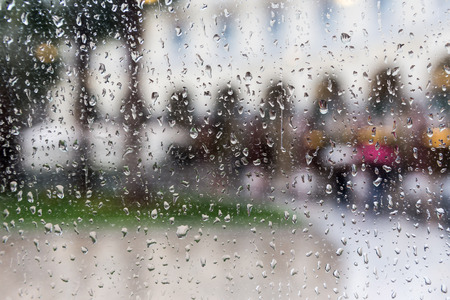 Drops of rain on a window pane, Blur buildings in background.