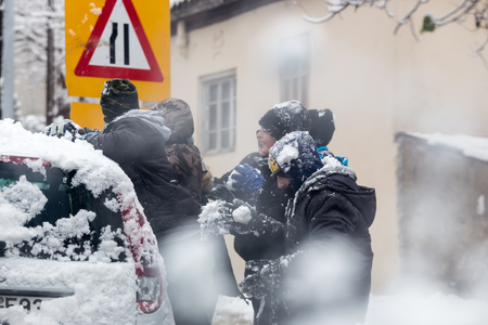 Thessaloniki, Greece - November 30, 2016: Boys and girls play with snowballs in Thessalonikiのeditorial素材