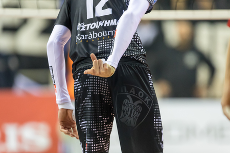Thessaloniki, Greece - February 6, 2017: player giving hand sign signal for play during the Hellenic Volleyball League game Paok vs Olympiacos at PAOK Sports Arena.のeditorial素材