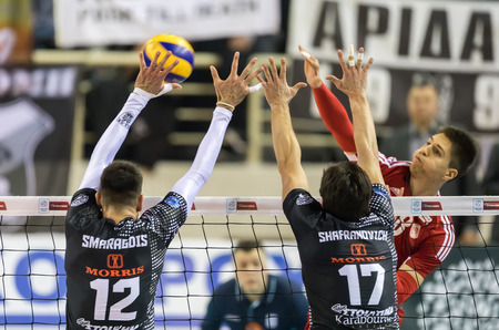 Thessaloniki, Greece - February 6, 2017: The team players in action during the Hellenic Volleyball League game Paok vs Olympiacos at PAOK Sports Arena.のeditorial素材