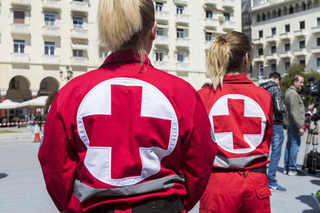 Thessaloniki , Greece - April 9, 2017: First aid, victim liberation in an car accident and helmet removal demonstration by the Hellenic Red Cross rescue teamのeditorial素材