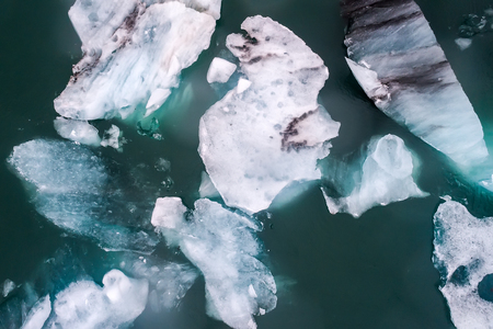 Aerial view of icebergs floating in Jokulsarlon Lagoon by the southern coast of Iceland. Soft focus....