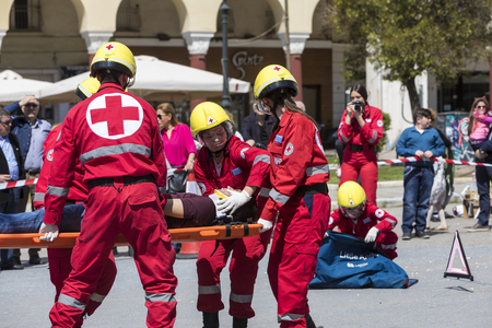 Thessaloniki , Greece - April 9, 2017: First aid, victim liberation in an car accident and helmet removal demonstration by the Hellenic Red Cross rescue teamのeditorial素材