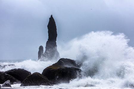 Turbulent waves that crash with great power on the black beach of Reynisfjara in the area of Vik in Icelandの写真素材