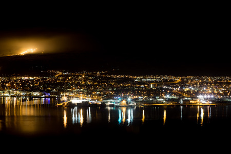 Panoramic view on Akureyri city at night in north icelandの写真素材