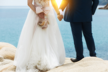 feet of bride and groom, wedding shoes. Soft focus.の写真素材