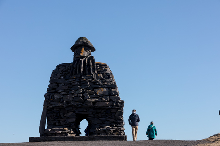 Arnarstapi, Iceland - March 31, 2017: Statue of Bardur Snaefellsnes, half-man, half-giant that is said to roam the Snaefellsnes glacier in Iceland. Made in 1985 by the sculptor Ragnar Kjartansson.のeditorial素材