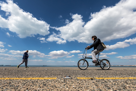 Thessaloniki, Greece - April 9, 2017: People enjoy a walk on the new park and the waterfront of the city of Thessaloniki during the dayのeditorial素材